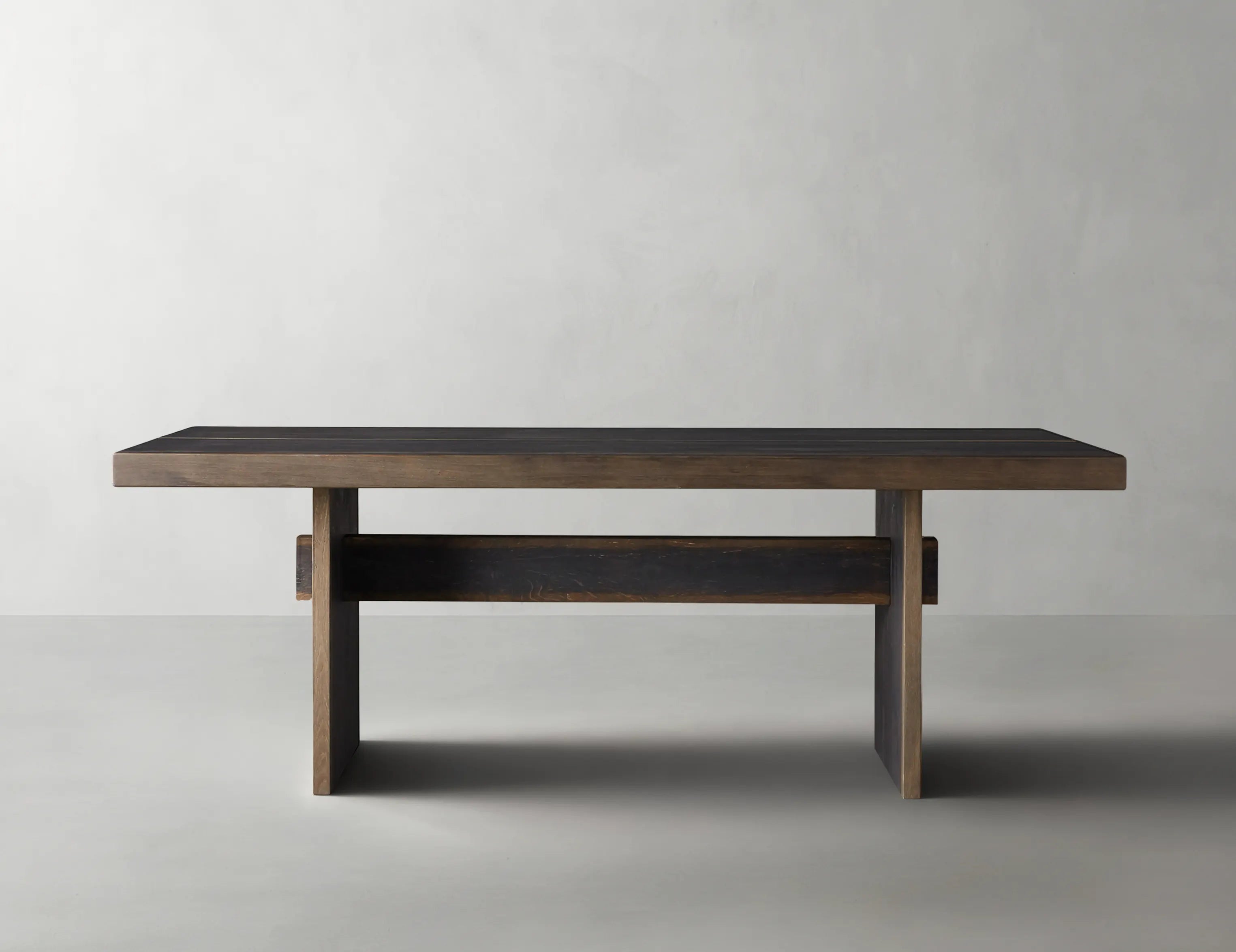 Wooden table with a dark finish on a plain background